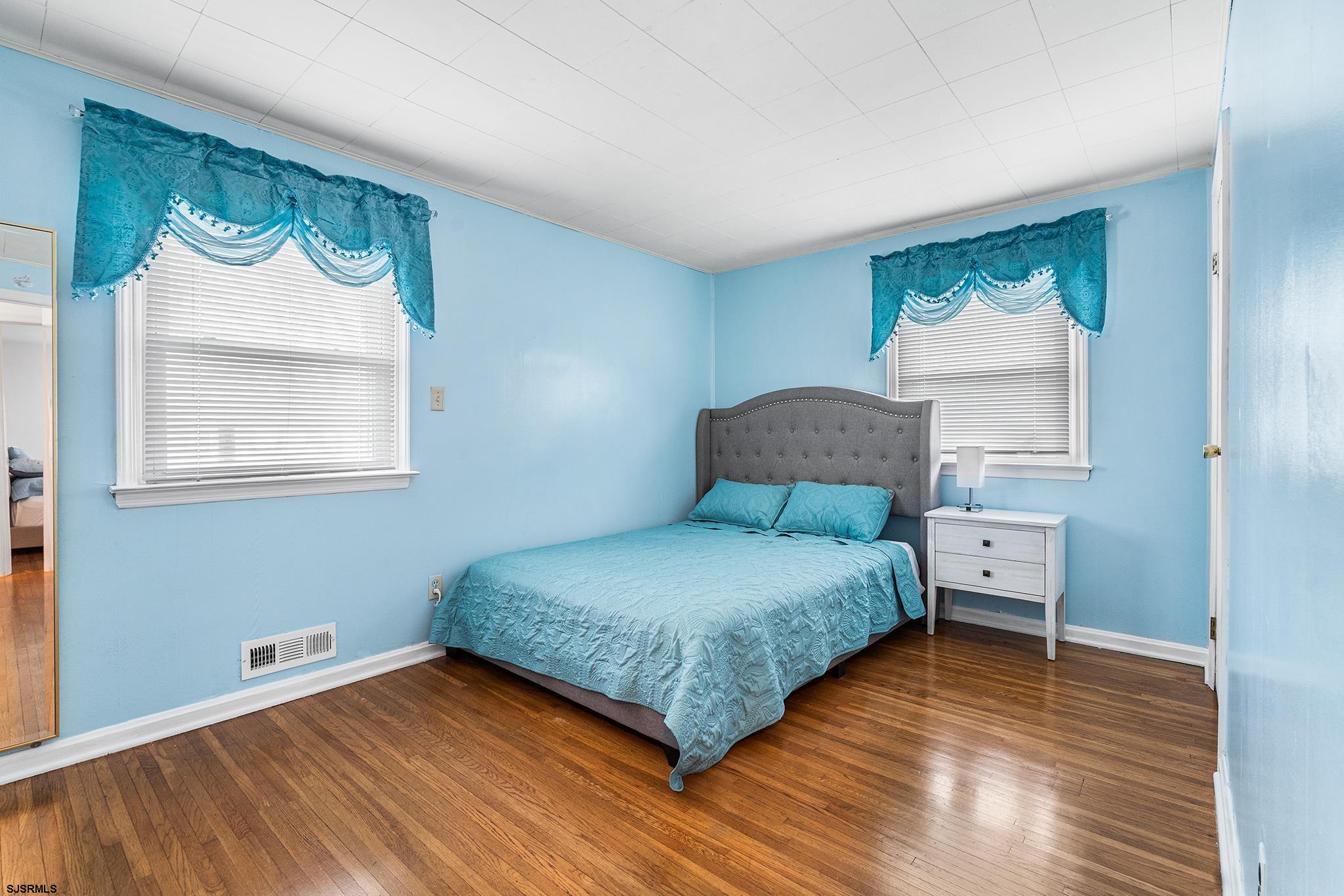 128 Devon Road Somers Point, NJ 08244 - Photo 24 of 40 a bedroom with a bed and window