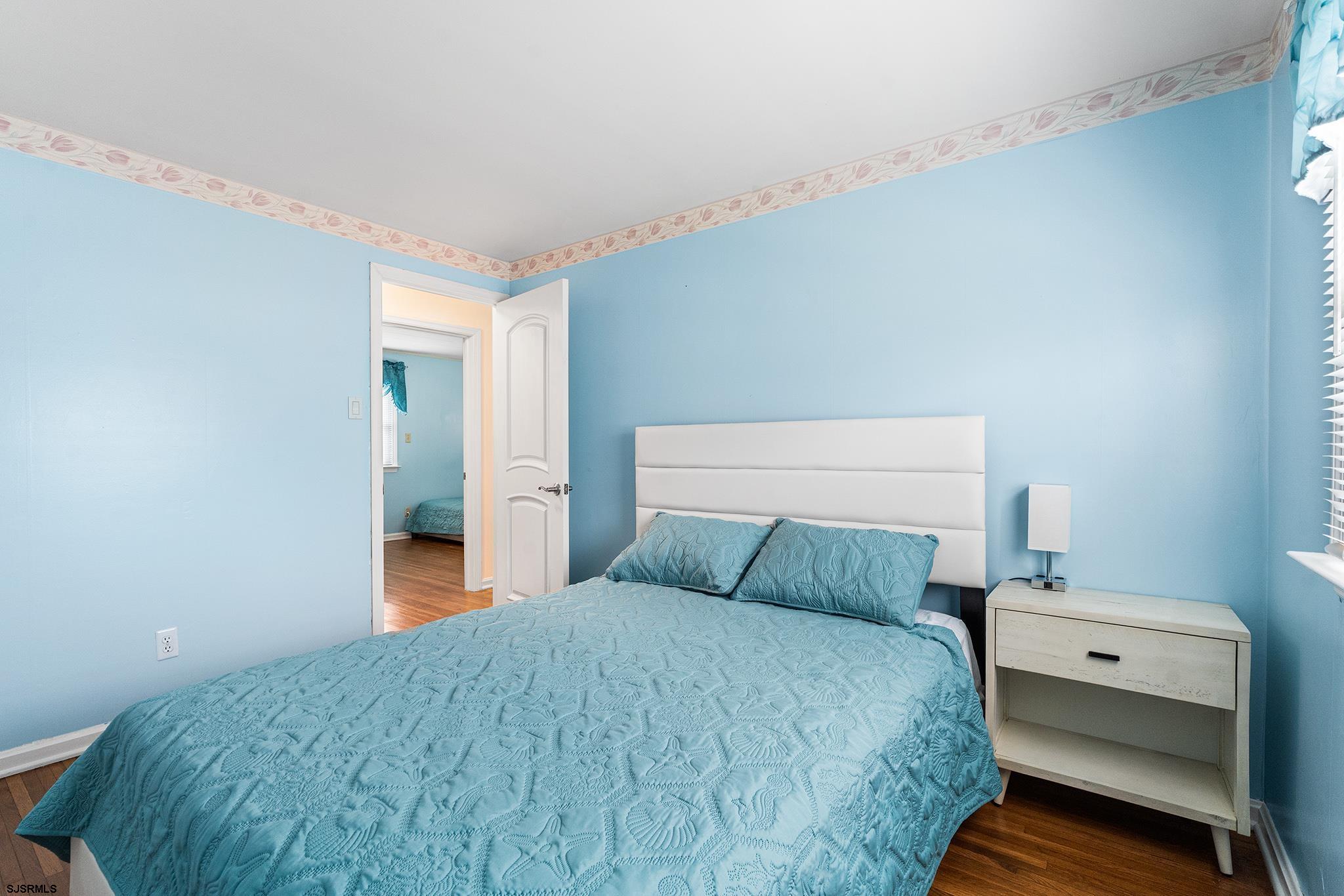 128 Devon Road Somers Point, NJ 08244 - Photo 27 of 40 a bedroom with a bed and window