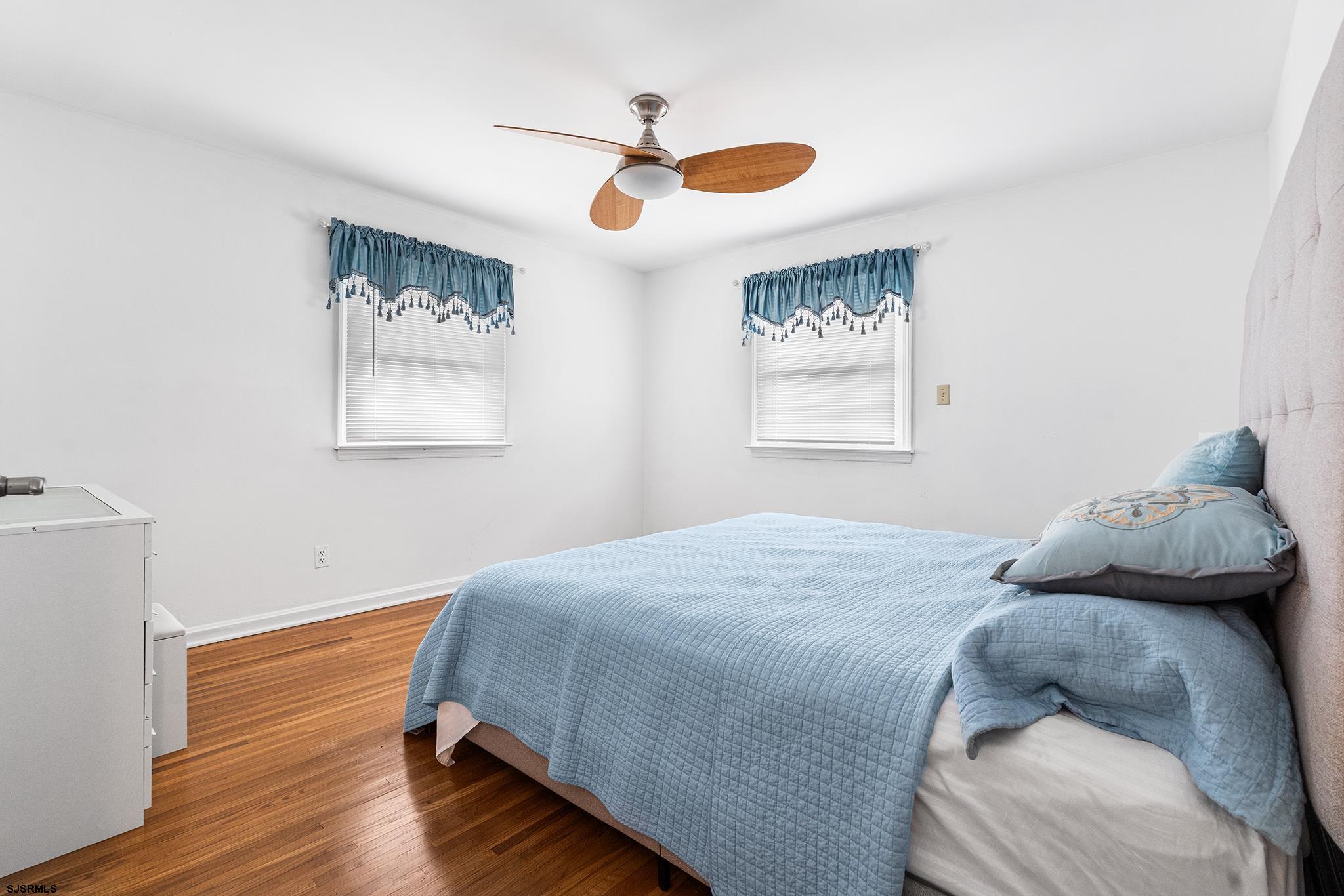 128 Devon Road Somers Point, NJ 08244 - Photo 28 of 40 a bedroom with a bed and a window