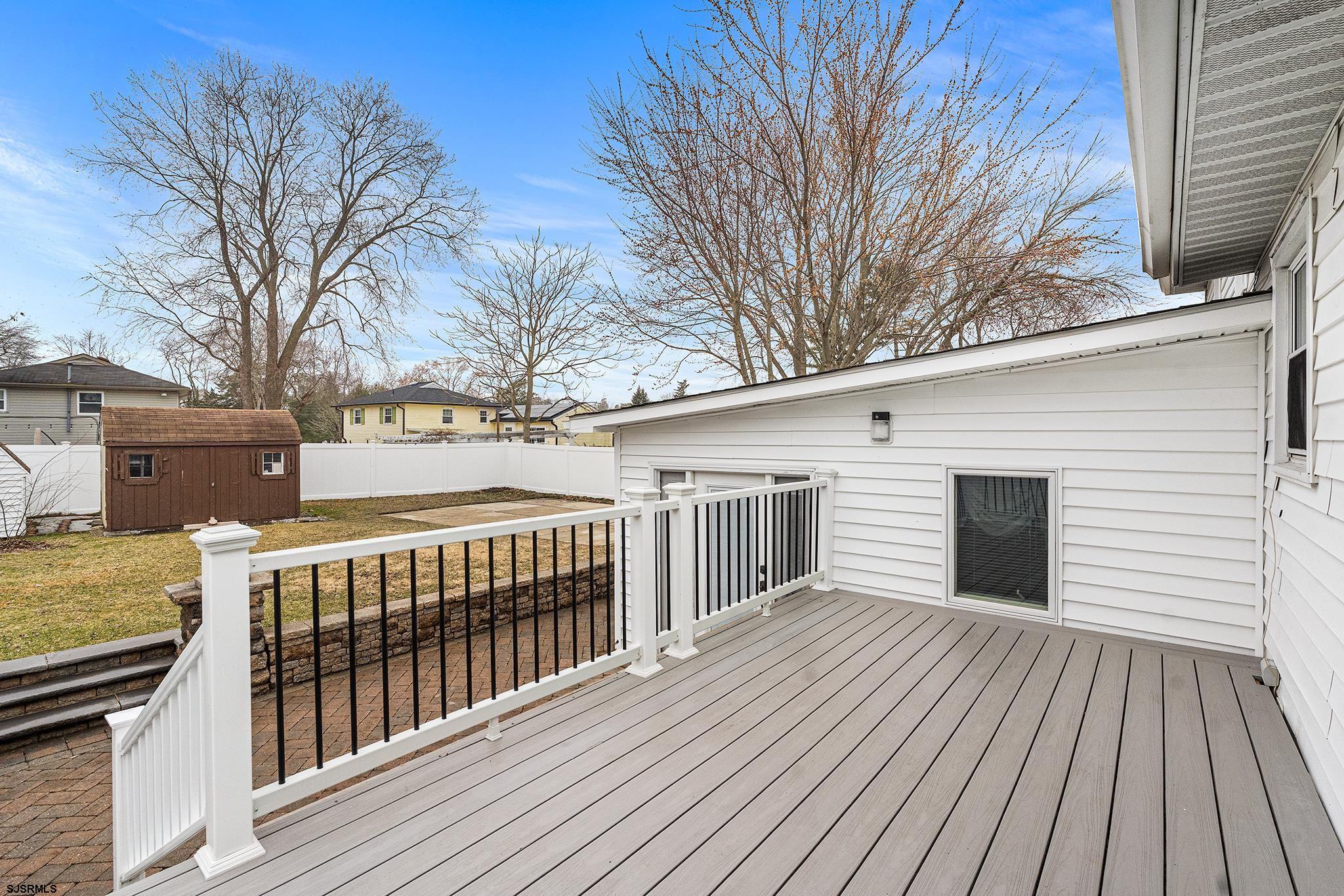 128 Devon Road Somers Point, NJ 08244 - Photo 30 of 40 a view of a house with a wooden deck