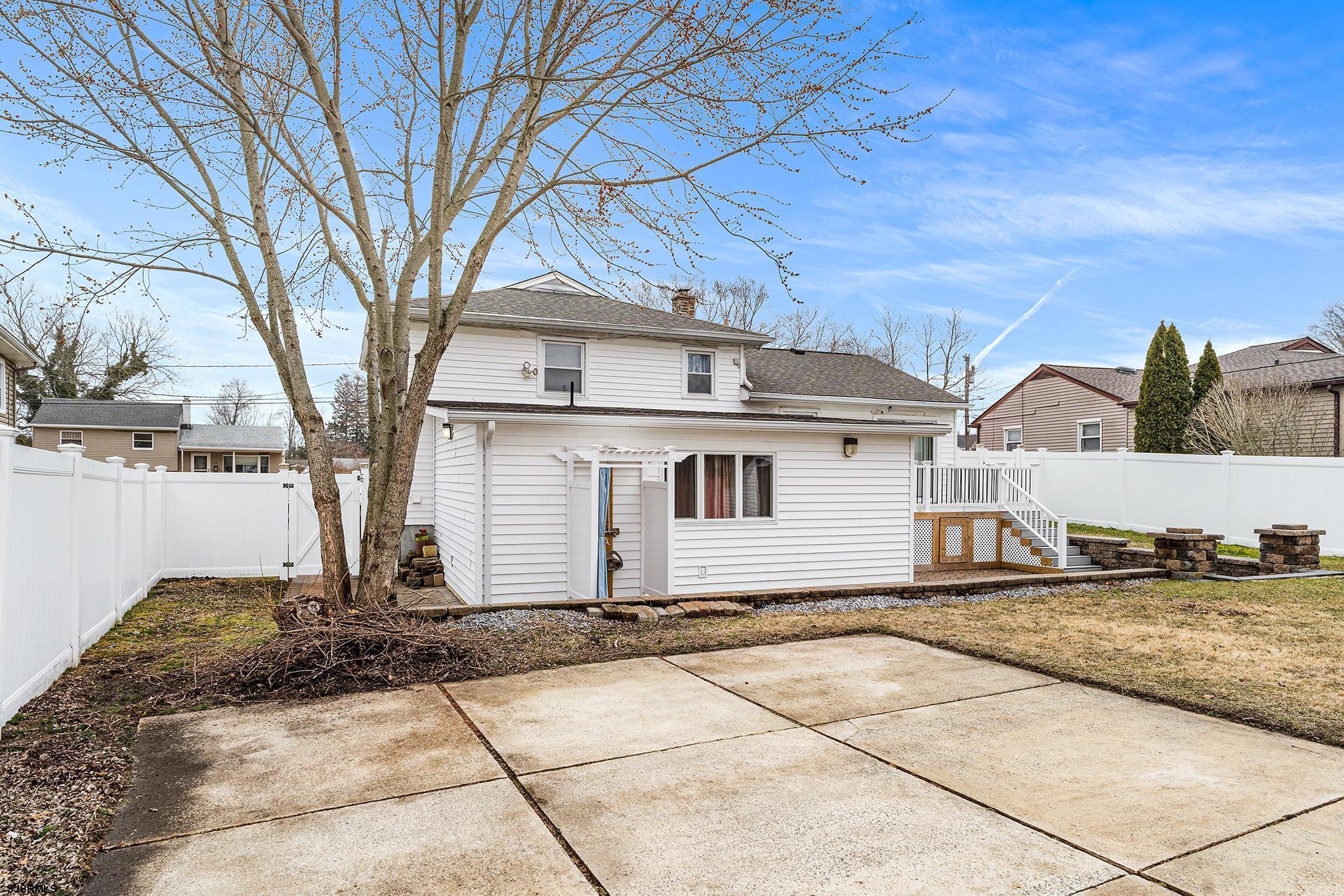 128 Devon Road Somers Point, NJ 08244 - Photo 37 of 40 a white house that has a tree in front of it