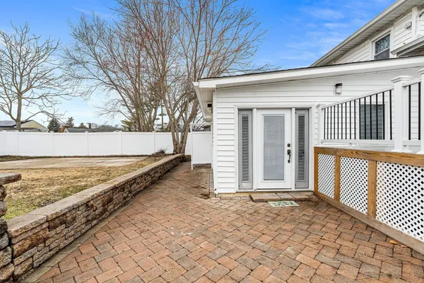 a view of a backyard with wooden fence