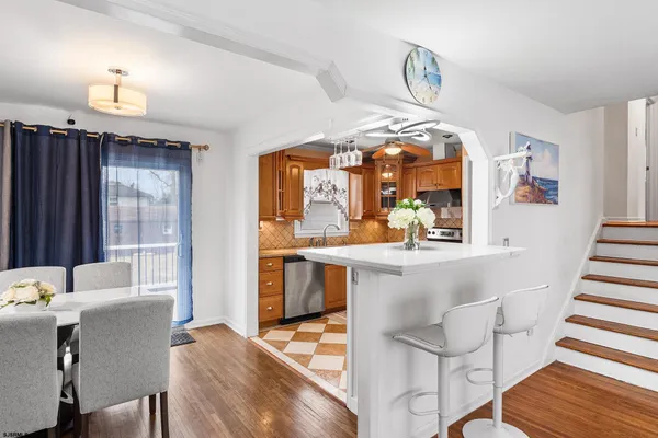 a dining room with furniture and window