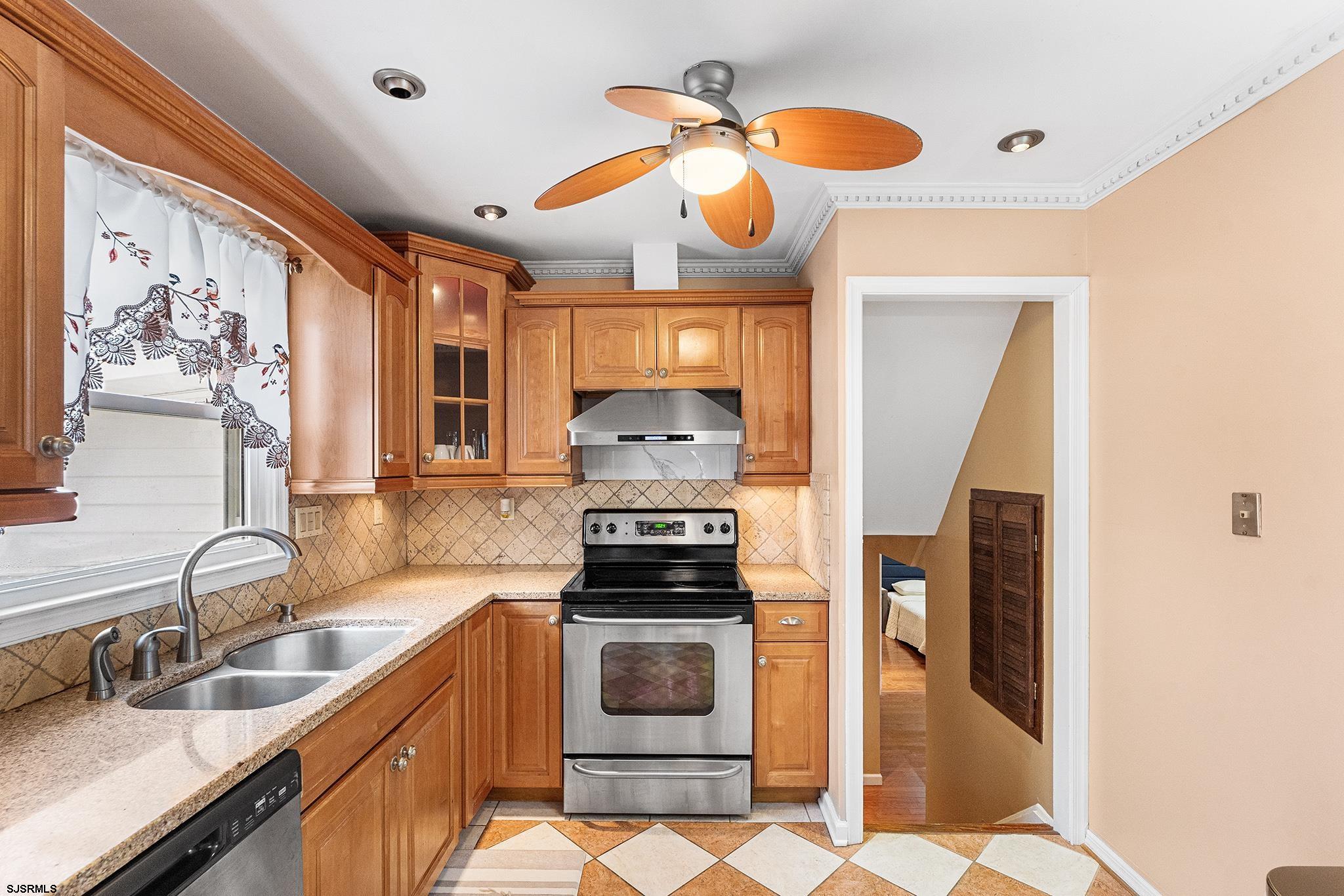 128 Devon Road Somers Point, NJ 08244 - Photo 10 of 40 a kitchen with granite countertop a stove and a sink