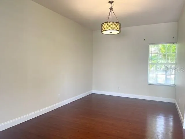 a kitchen with stainless steel appliances granite countertop a refrigerator a stove top oven a sink and dishwasher