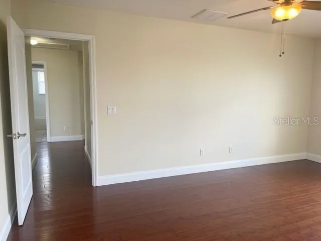 a bathroom with a toilet a sink and a mirror
