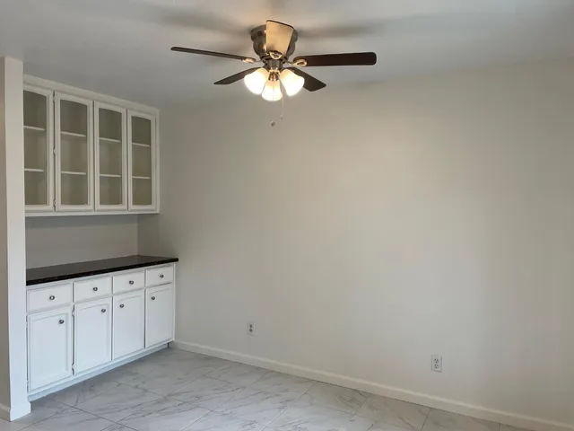an empty room with cabinet
