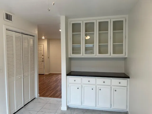 a view of cabinet with mirror