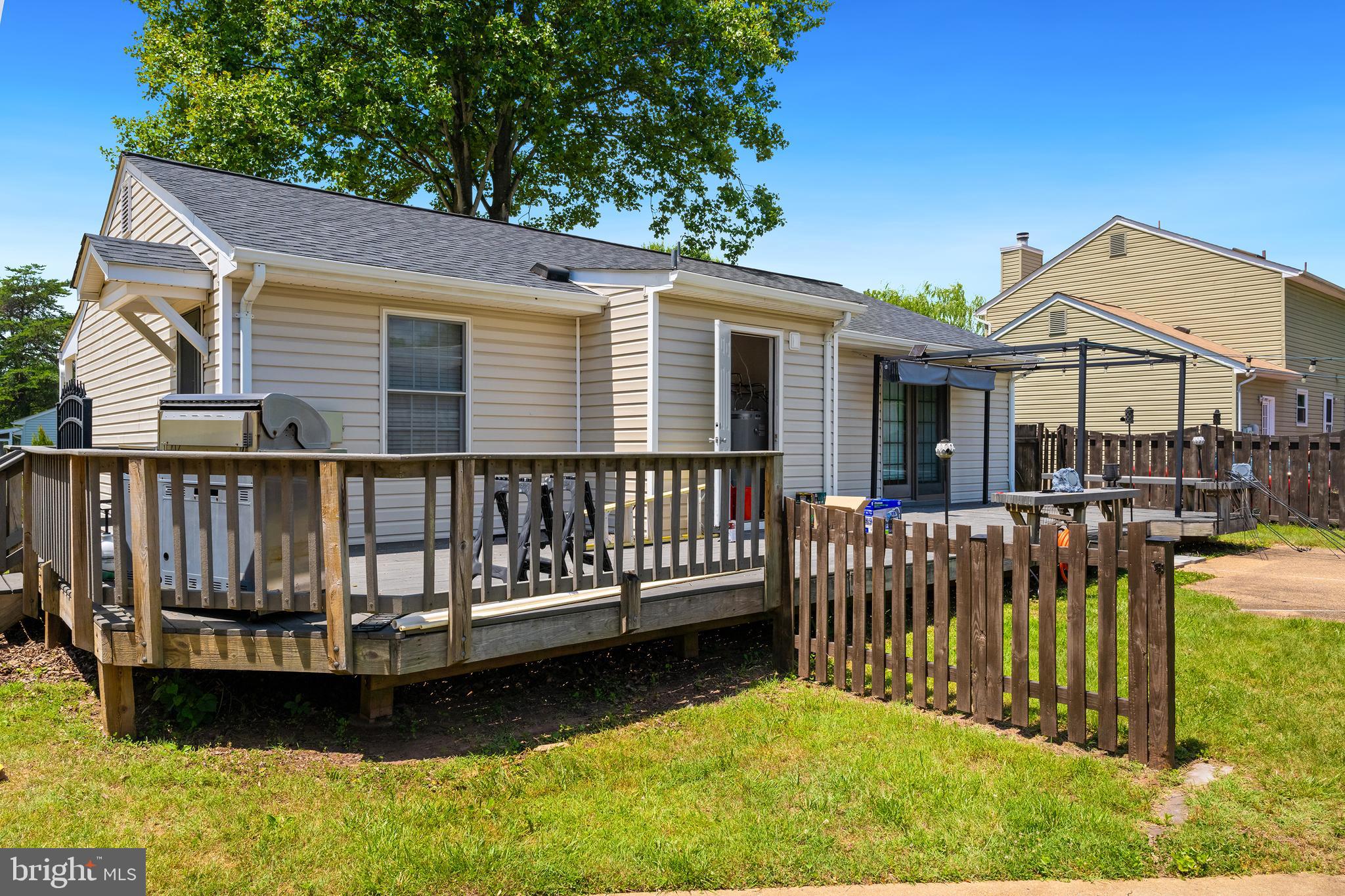 10303 Abbott Road Manassas, VA 20110 - Photo 22 of 36 a view of a house with a wooden deck