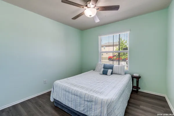 a bedroom with a bed and window