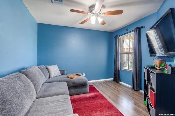 a bed room with a bed furniture and a flat screen tv