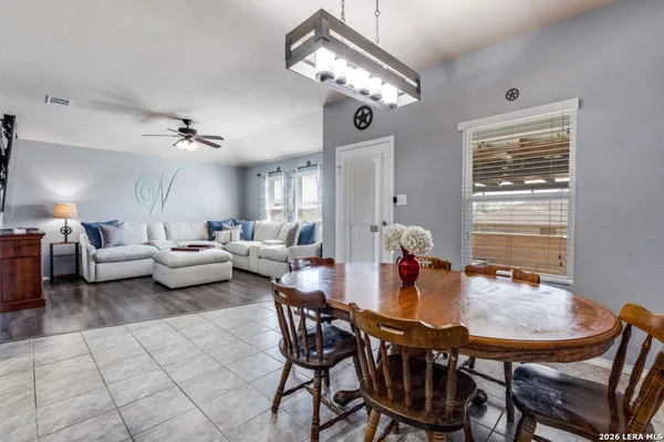 a dining room with furniture and window