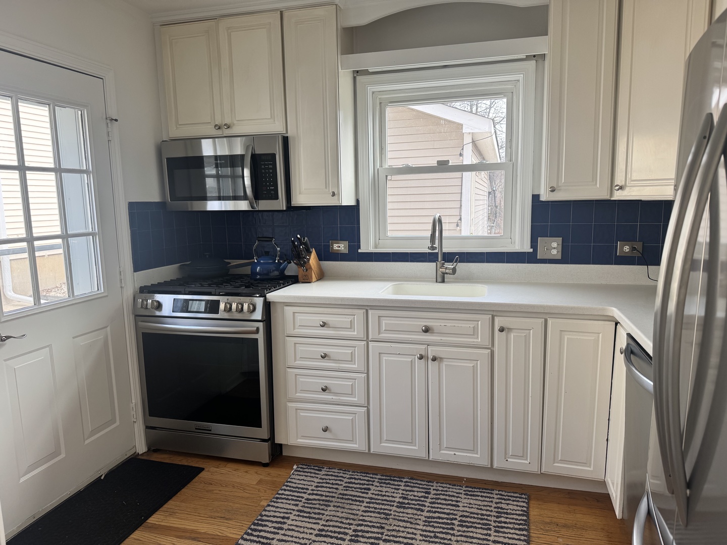 1039 Springfield Avenue Deerfield, IL 60015 - Photo 2 of 5 a kitchen with stainless steel appliances granite countertop a sink stove and cabinets