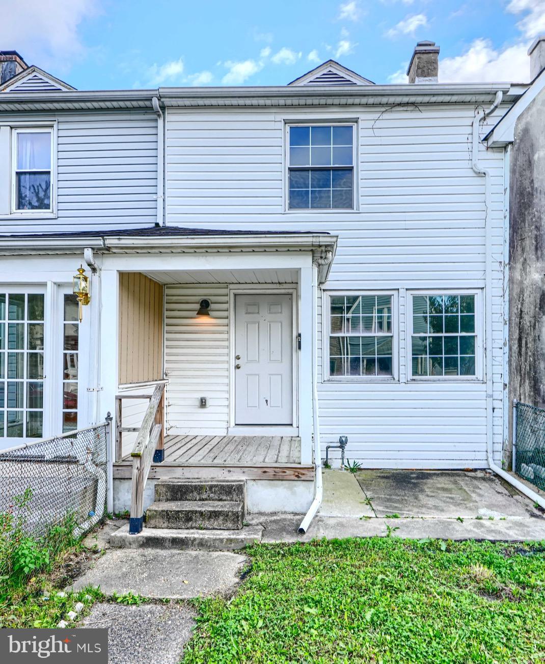 213 Colgate Avenue Baltimore, MD 21222 - Photo 1 of 24 a front view of a house with garden