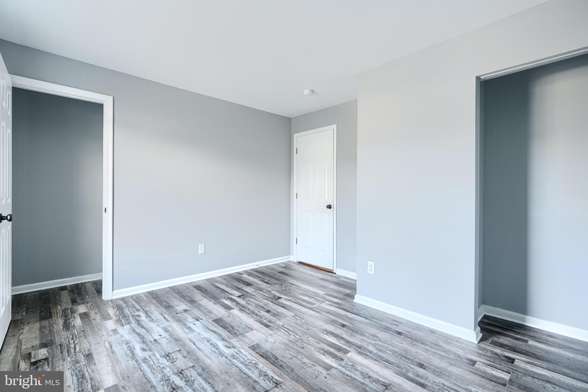 213 Colgate Avenue Baltimore, MD 21222 - Photo 13 of 24 a view of room with wooden floor