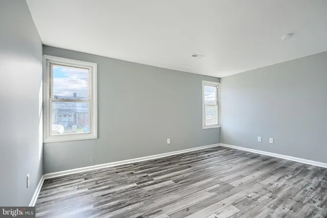 a view of room window and wooden floor