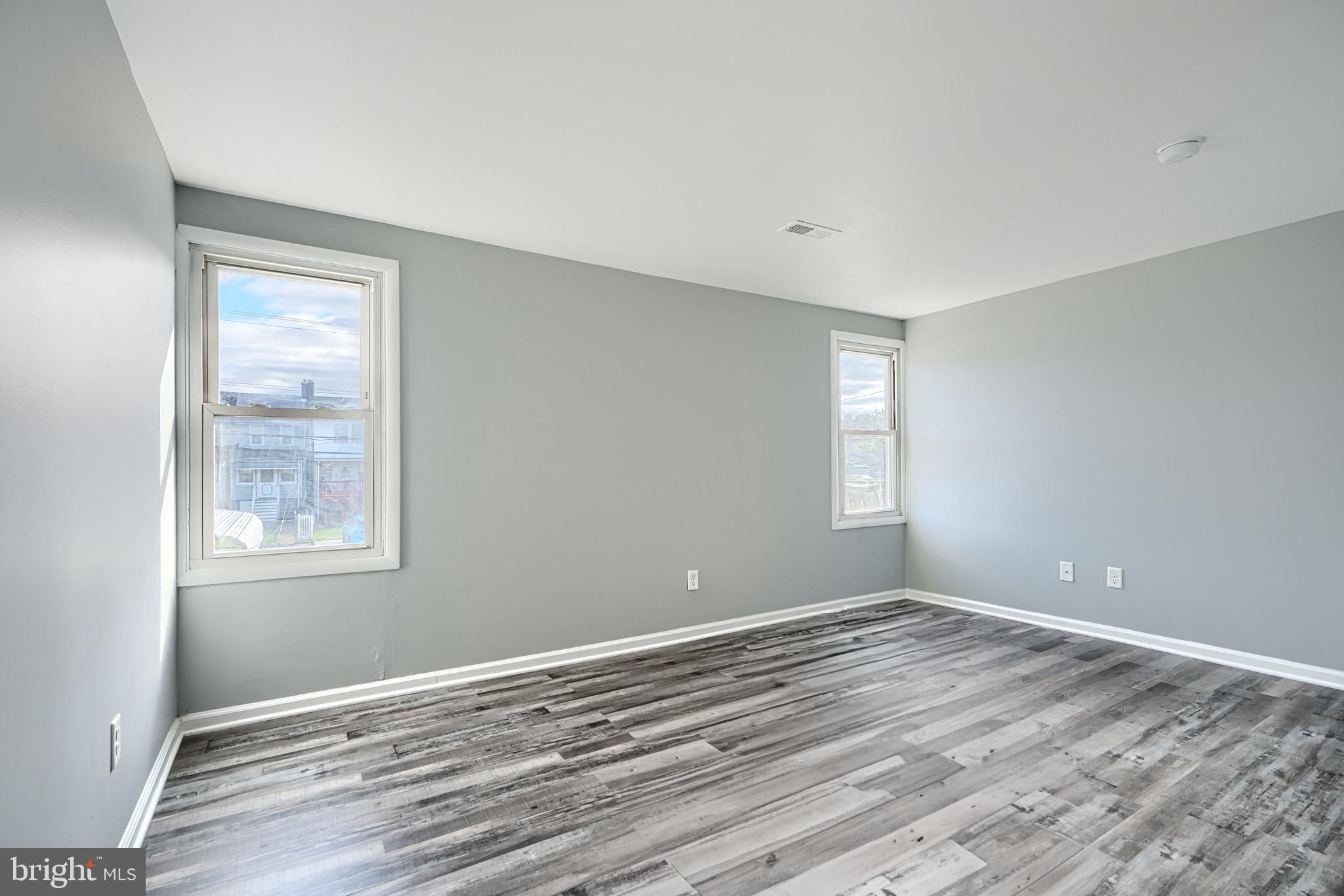 213 Colgate Avenue Baltimore, MD 21222 - Photo 15 of 24 a view of room window and wooden floor