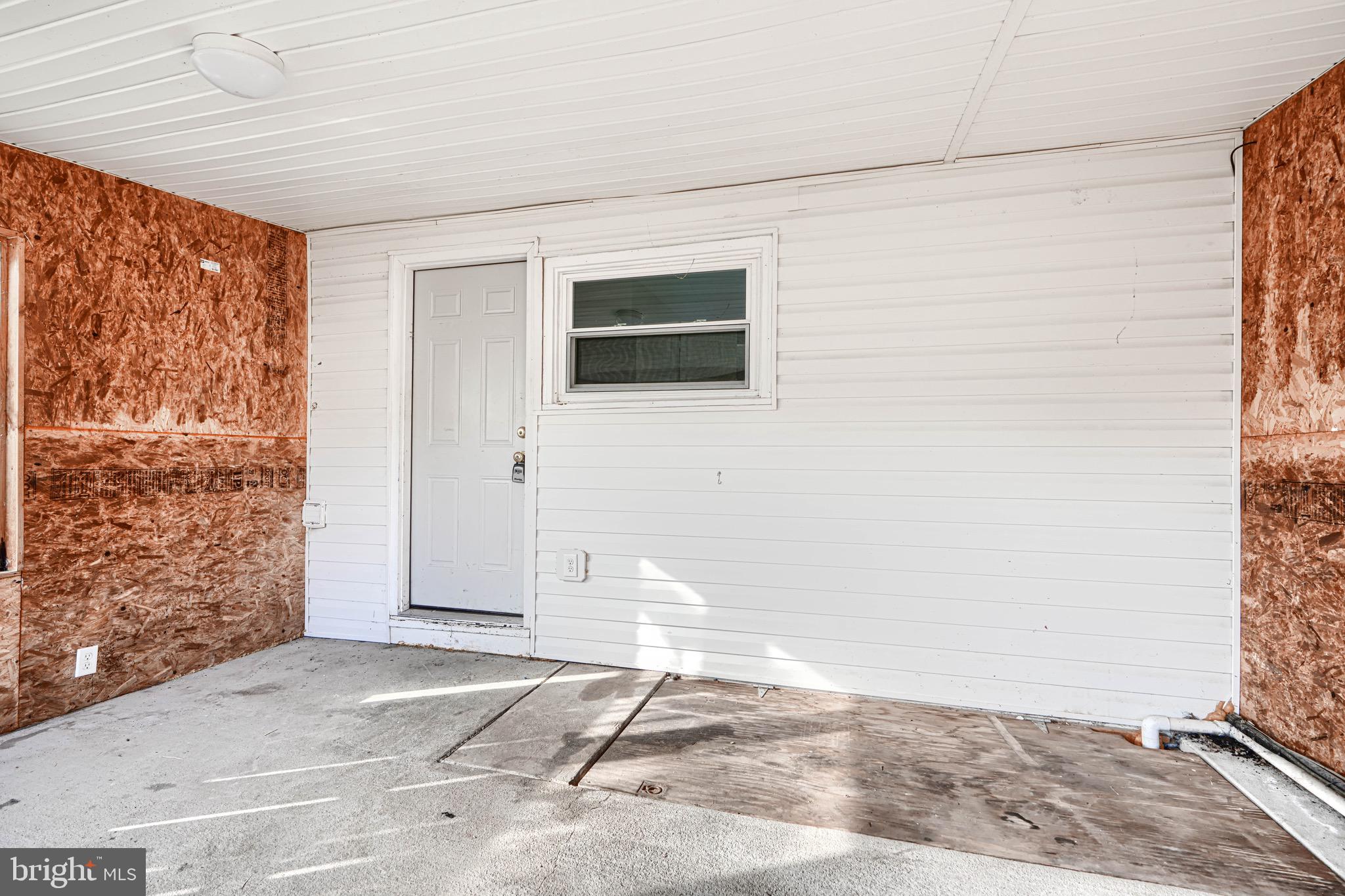 213 Colgate Avenue Baltimore, MD 21222 - Photo 21 of 24 a view of a livingroom with wooden floor and a window