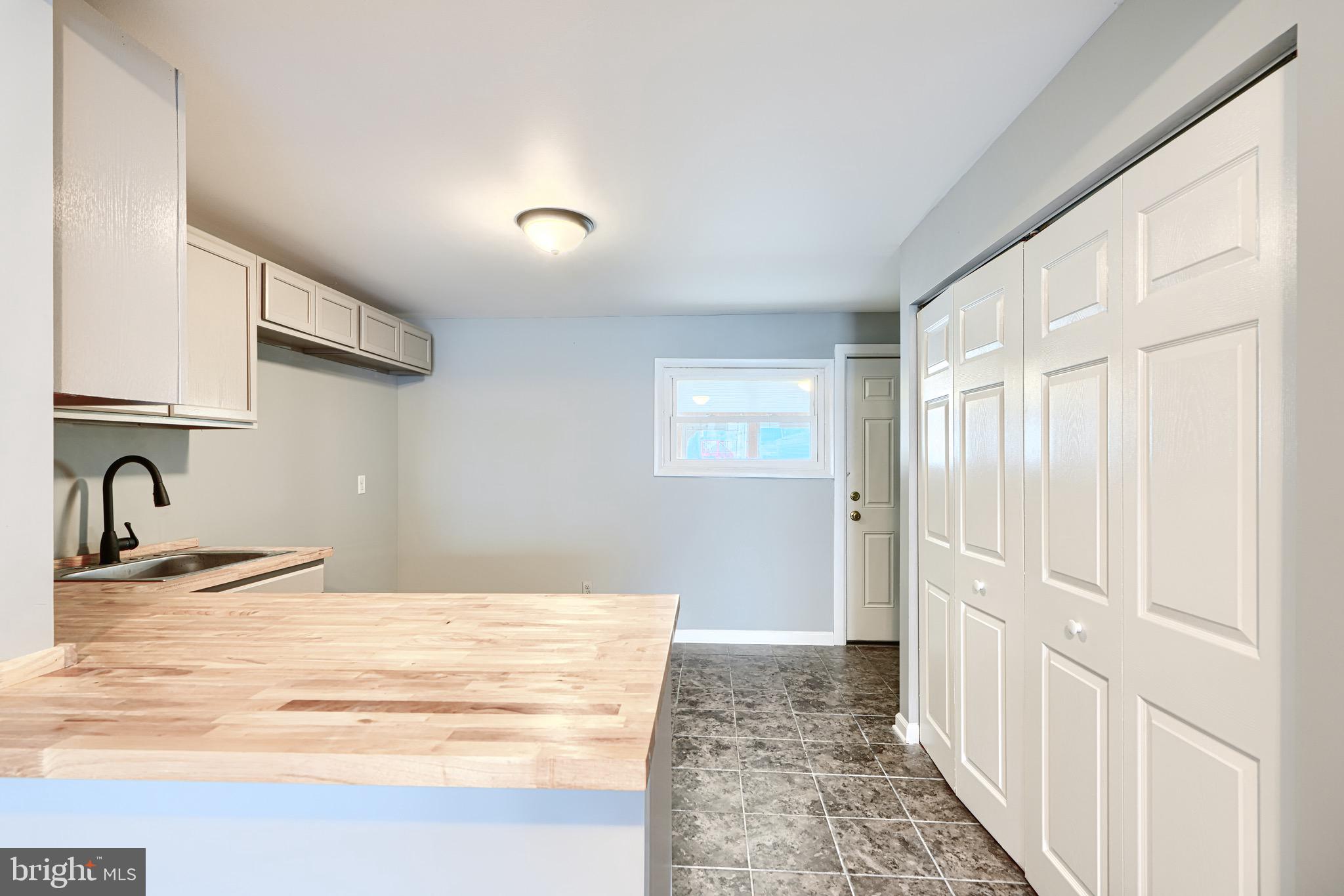 213 Colgate Avenue Baltimore, MD 21222 - Photo 8 of 24 a view of a kitchen from the hallway