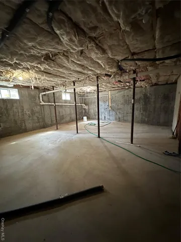 a view of a room with wooden walls