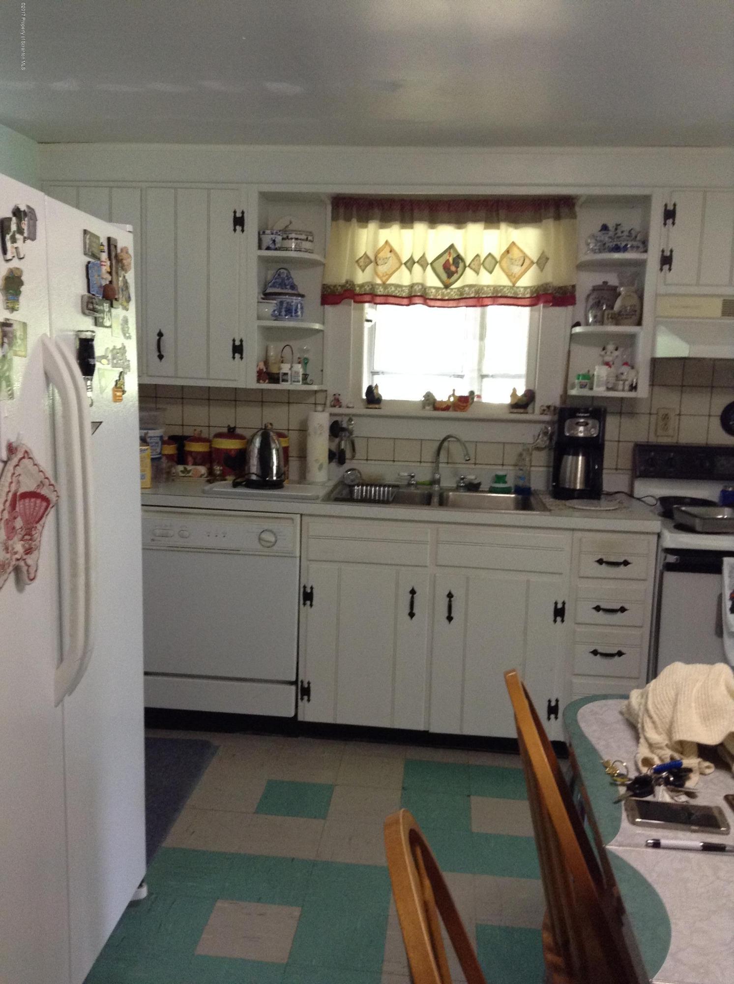 2714 Hunsinger Road Hallstead, PA 18822 - Photo 5 of 30 a kitchen with stainless steel appliances a stove a sink and a refrigerator