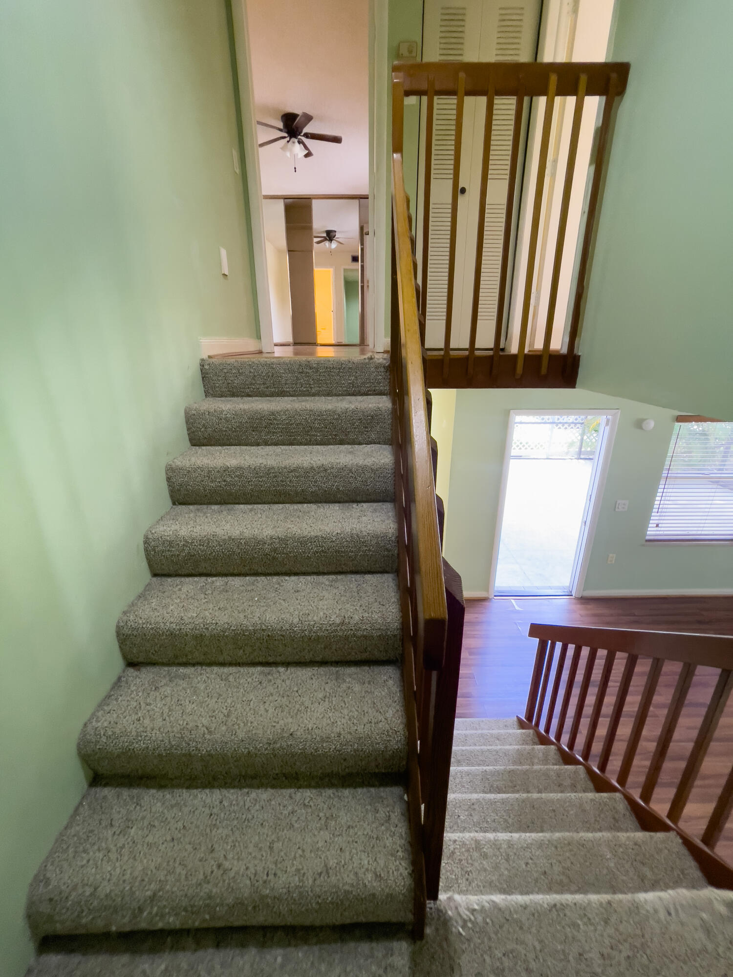 27 Clinton Court, Unit D Royal Palm Beach, FL 33411 - Photo 14 of 32 a view of entryway and hall with wooden floor