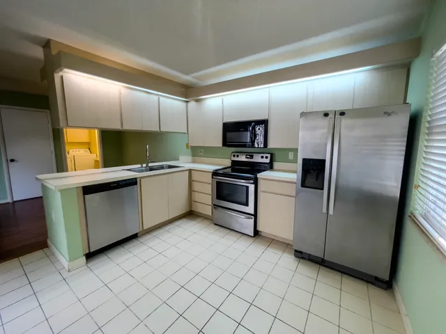 a bathroom with a sink mirror and toilet