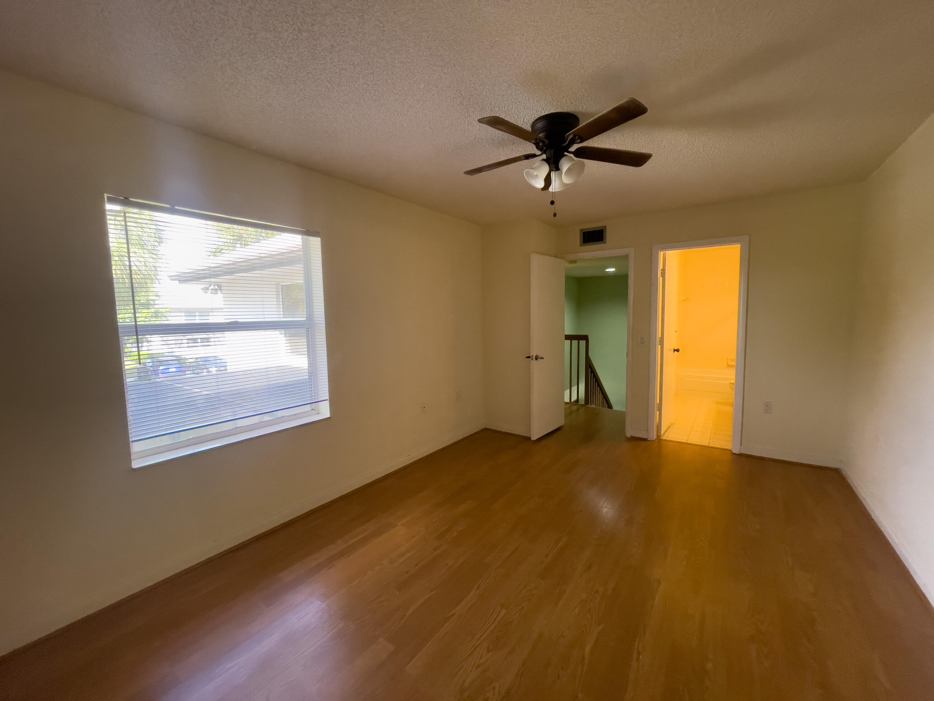 27 Clinton Court, Unit D Royal Palm Beach, FL 33411 - Photo 28 of 32 a view of an empty room with a window