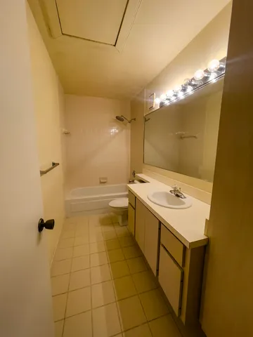 a view of hallway with wooden floor