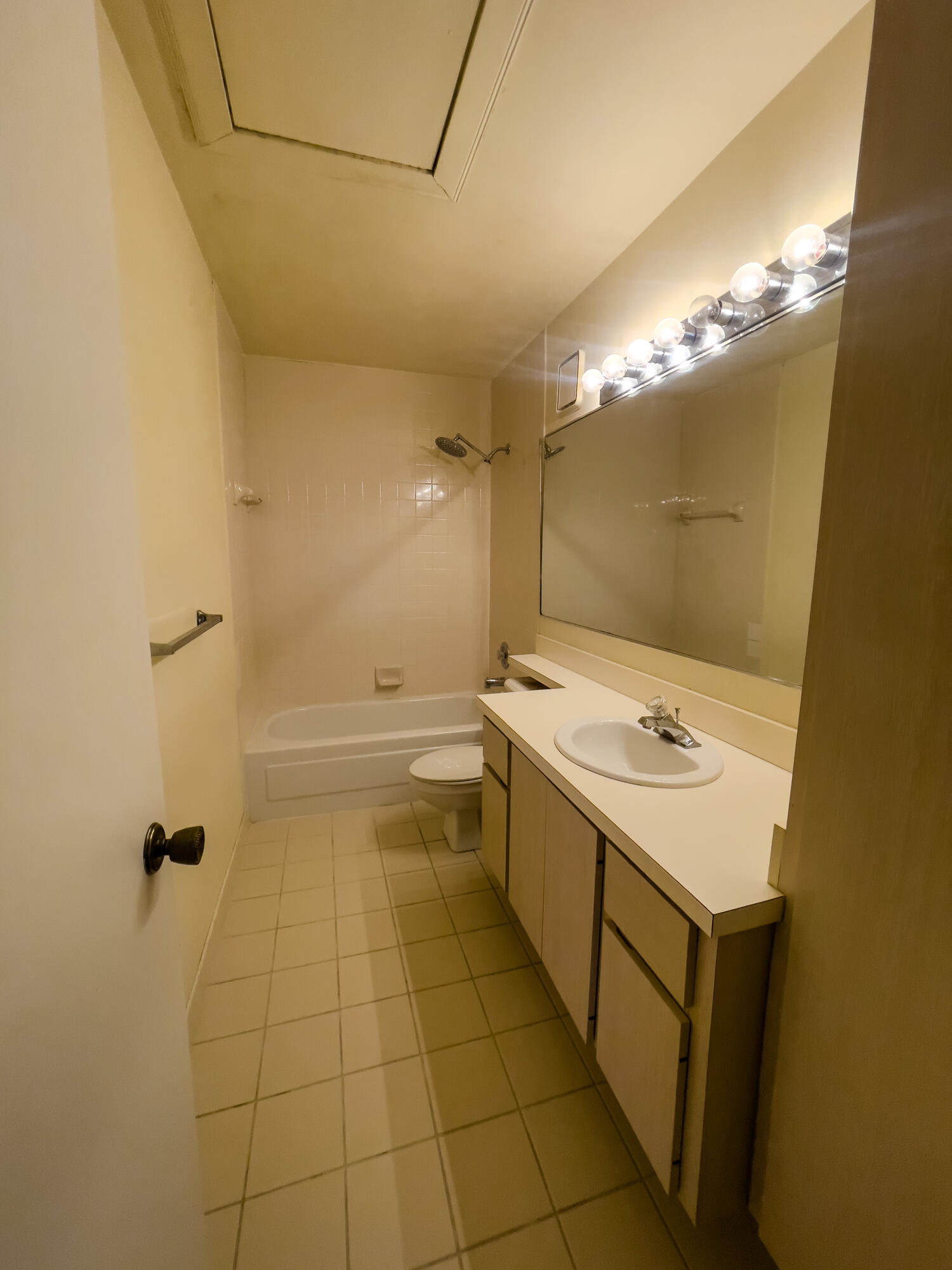 27 Clinton Court, Unit D Royal Palm Beach, FL 33411 - Photo 29 of 32 a bathroom with a sink a toilet and shower