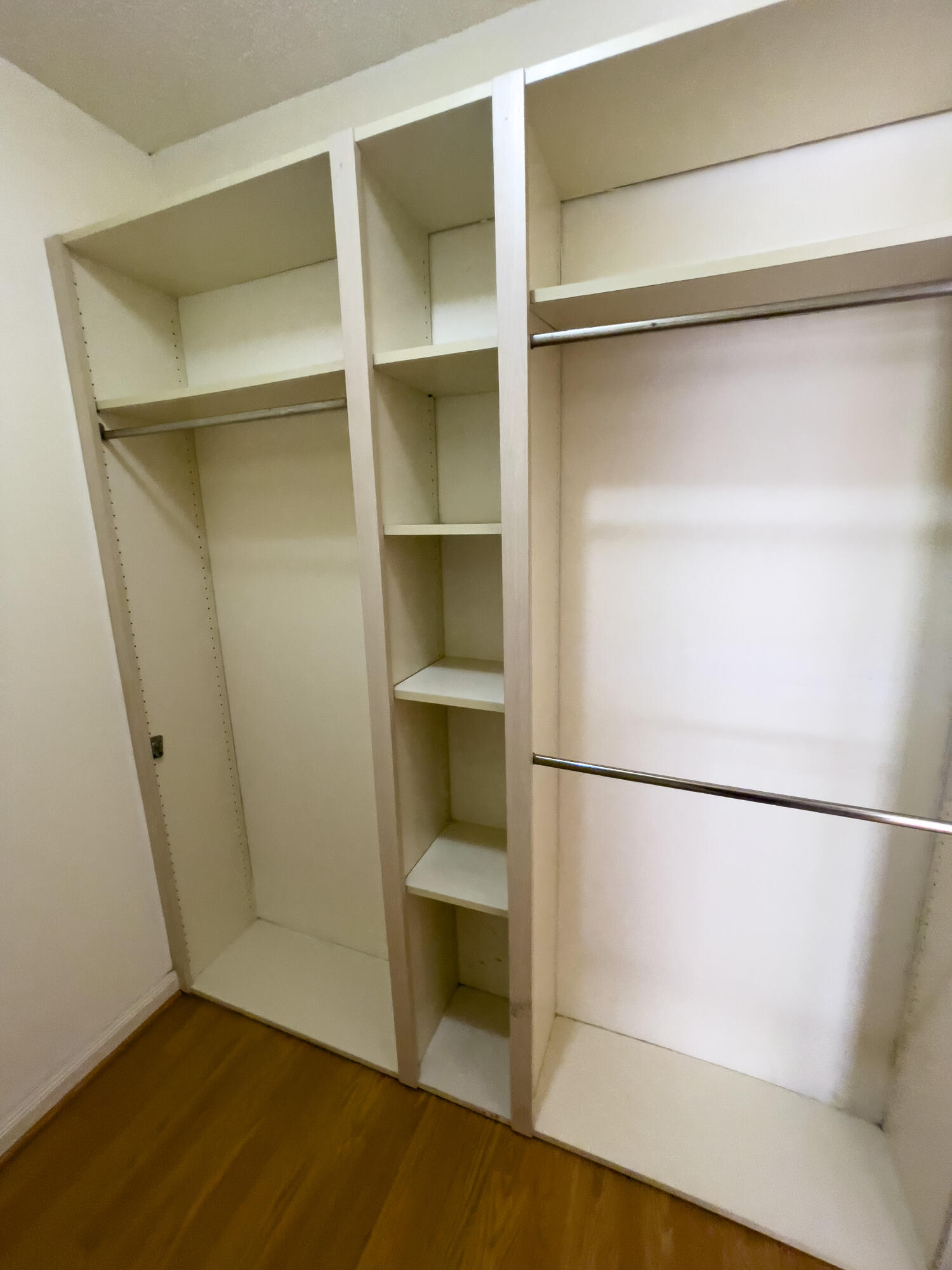 27 Clinton Court, Unit D Royal Palm Beach, FL 33411 - Photo 32 of 32 a view of an empty walk in closet