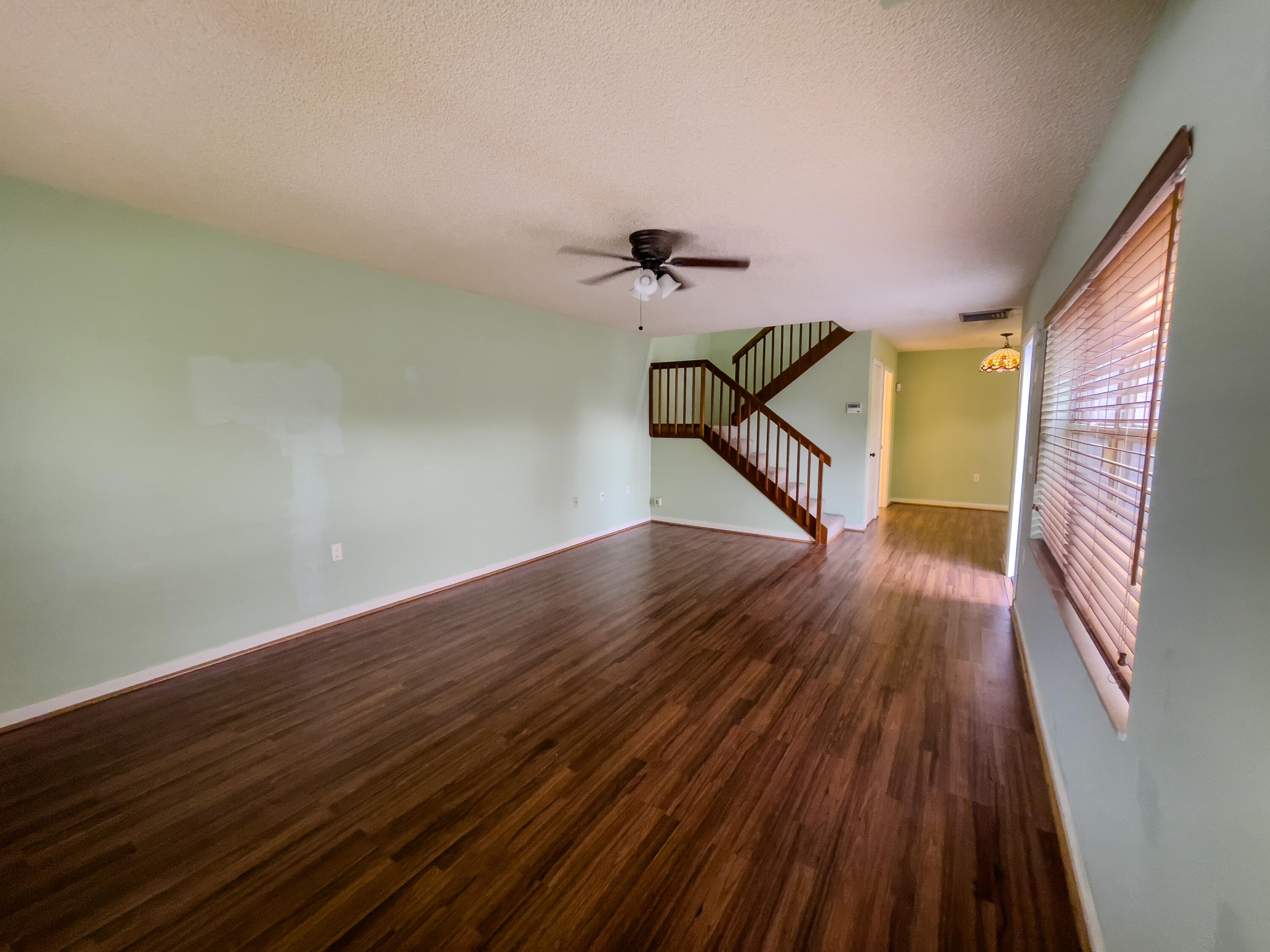 27 Clinton Court, Unit D Royal Palm Beach, FL 33411 - Photo 8 of 32 a view of an entryway with wooden floor