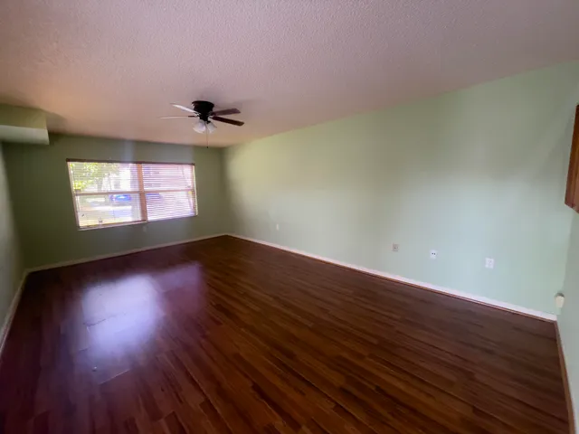 a view of kitchen and kitchen with wooden floor