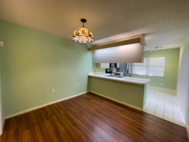 a bathroom with a sink toilet and a mirror