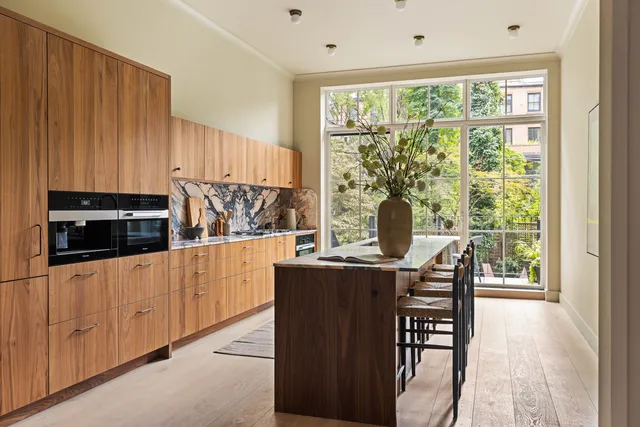 a living room with a couch and a large window