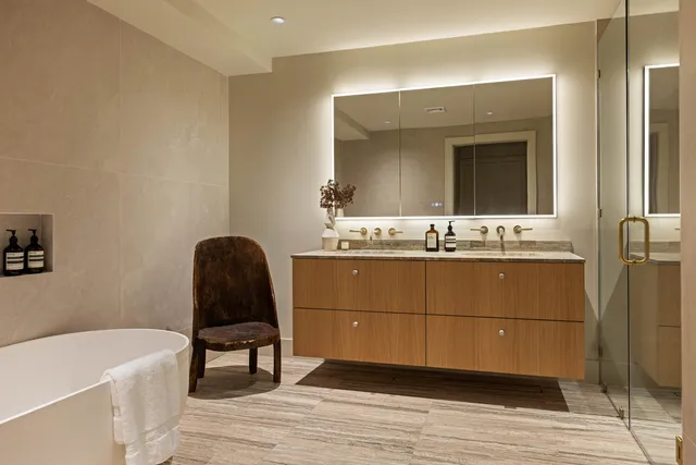 a bathroom with a sink vanity and a mirror