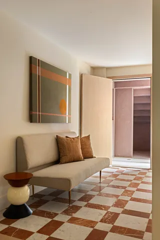 a living room with furniture and a window