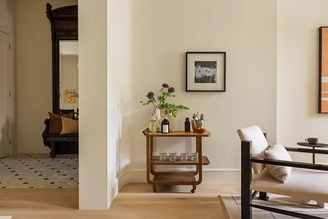 a bedroom with furniture and wooden floor