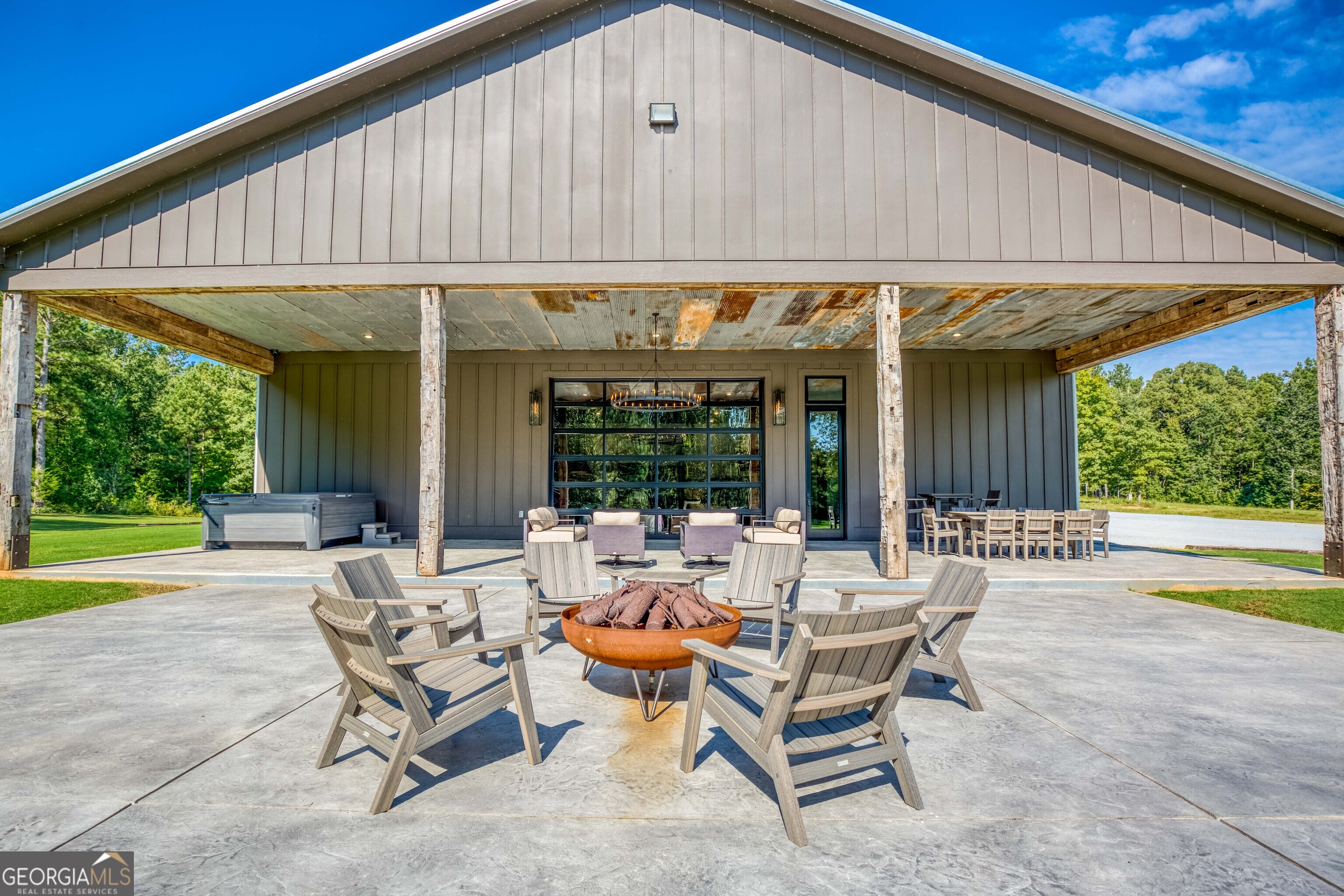 1968 Bobby Brown State Park Road Elberton, GA 30635 - Photo 13 of 97 a patio with a table and chairs and potted plants