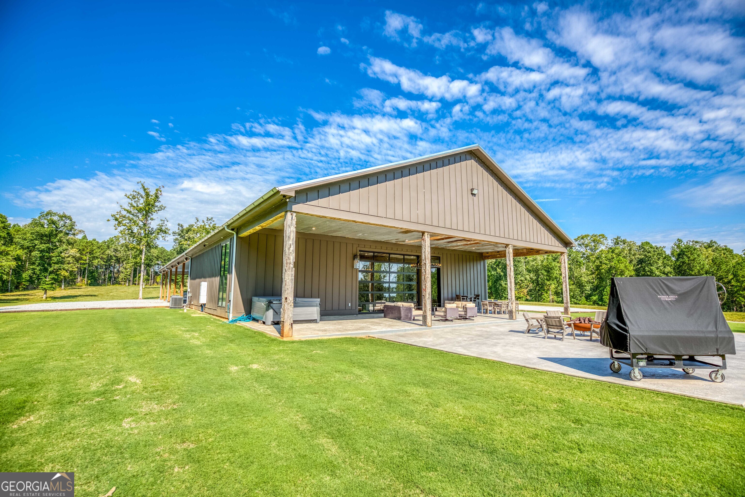 1968 Bobby Brown State Park Road Elberton, GA 30635 - Photo 14 of 97 a view of a patio with table and chairs and potted plants with large tree