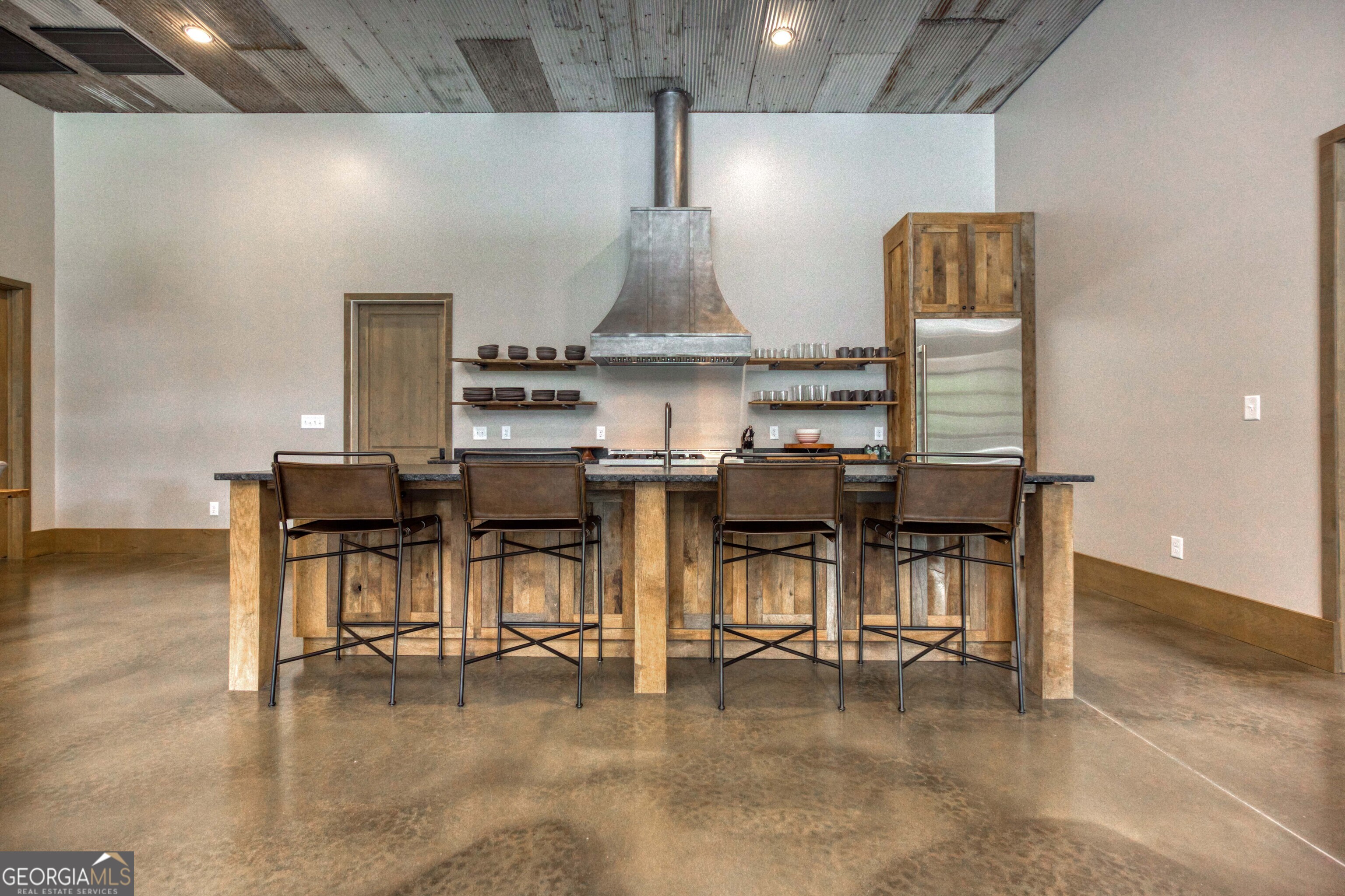1968 Bobby Brown State Park Road Elberton, GA 30635 - Photo 35 of 97 a kitchen with stainless steel appliances kitchen island hardwood floor and dining table