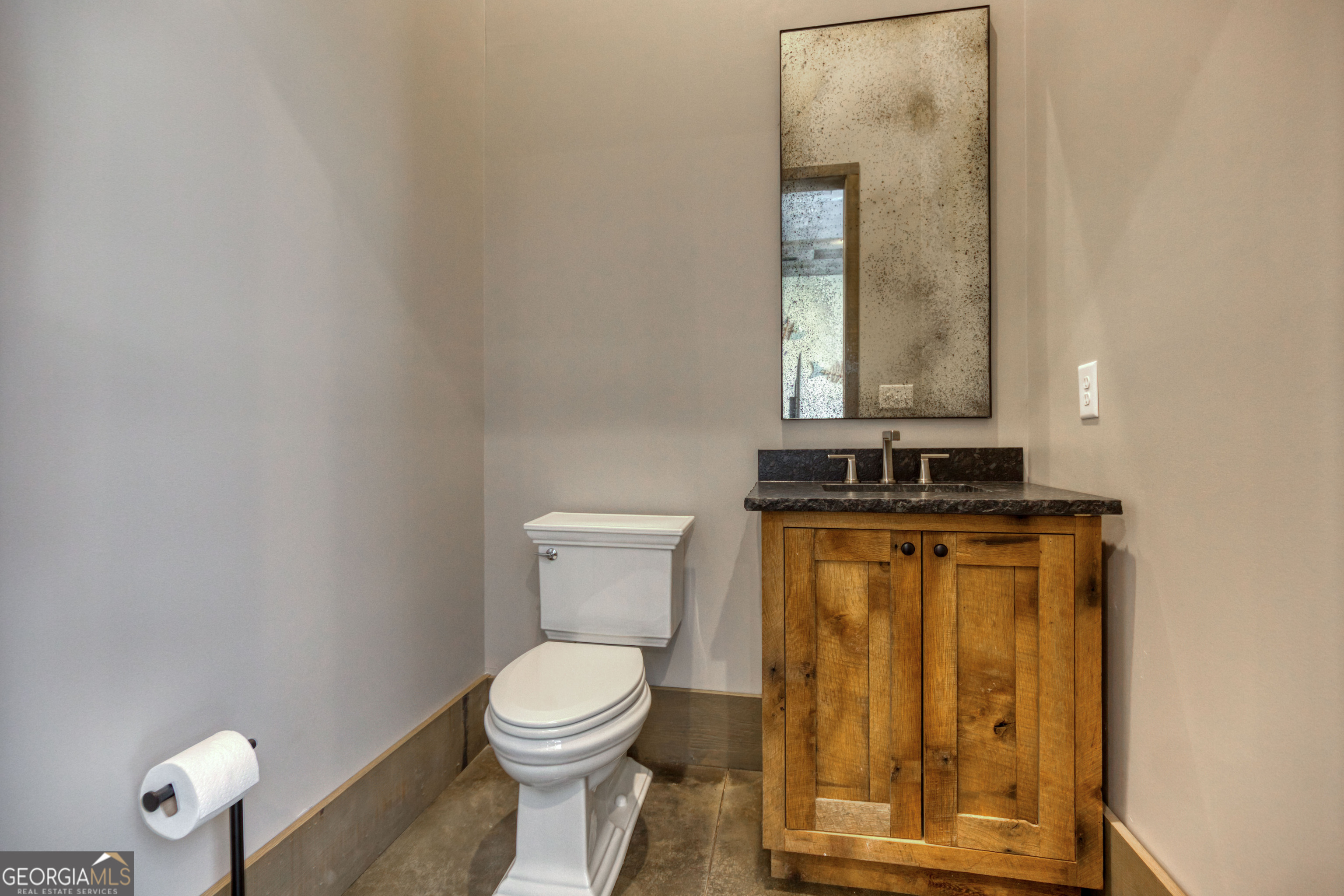 1968 Bobby Brown State Park Road Elberton, GA 30635 - Photo 38 of 97 a bathroom with a toilet sink and mirror