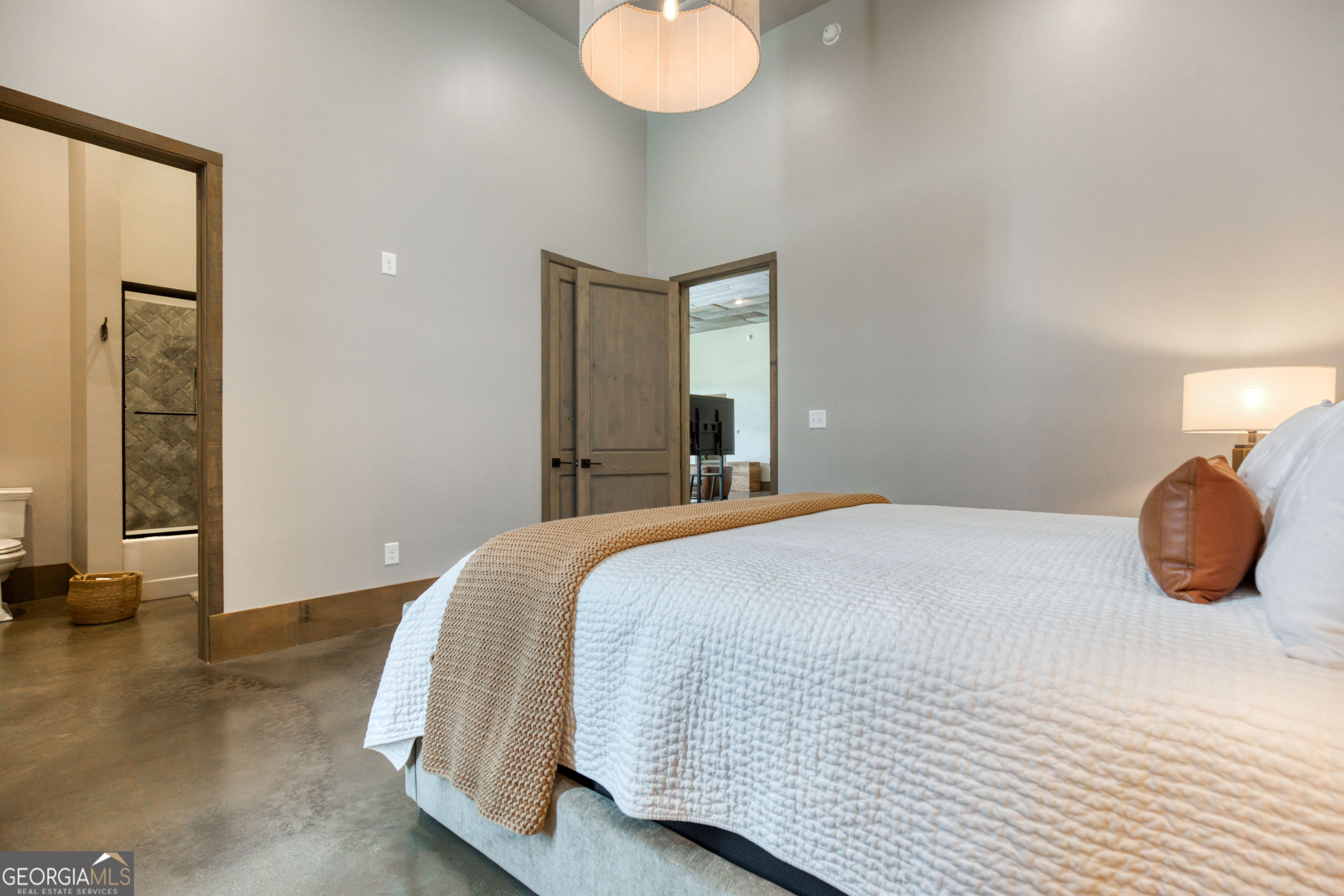 1968 Bobby Brown State Park Road Elberton, GA 30635 - Photo 47 of 97 a bedroom with a bed and chandelier