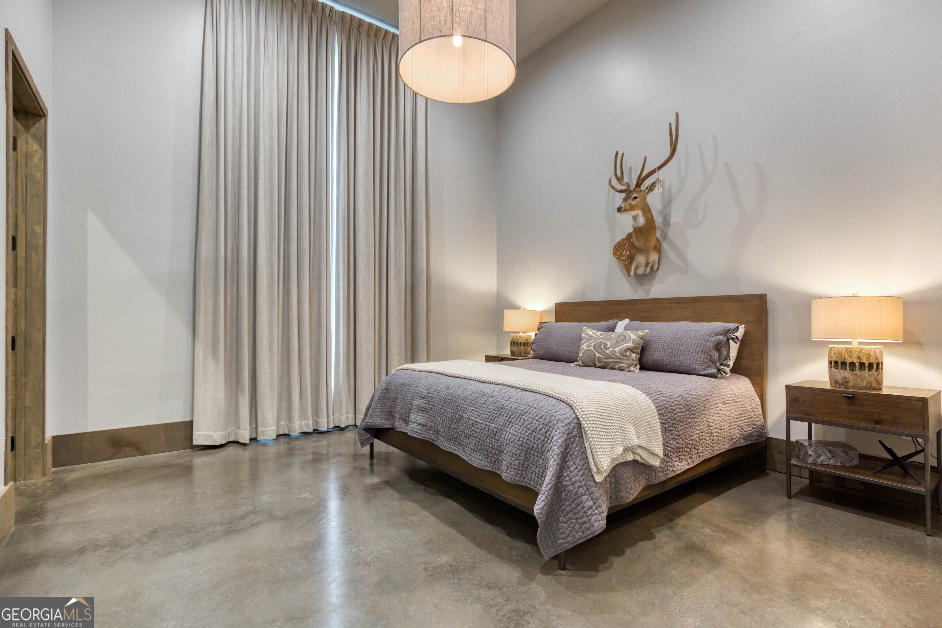 1968 Bobby Brown State Park Road Elberton, GA 30635 - Photo 50 of 97 a spacious bedroom with a bed and a window