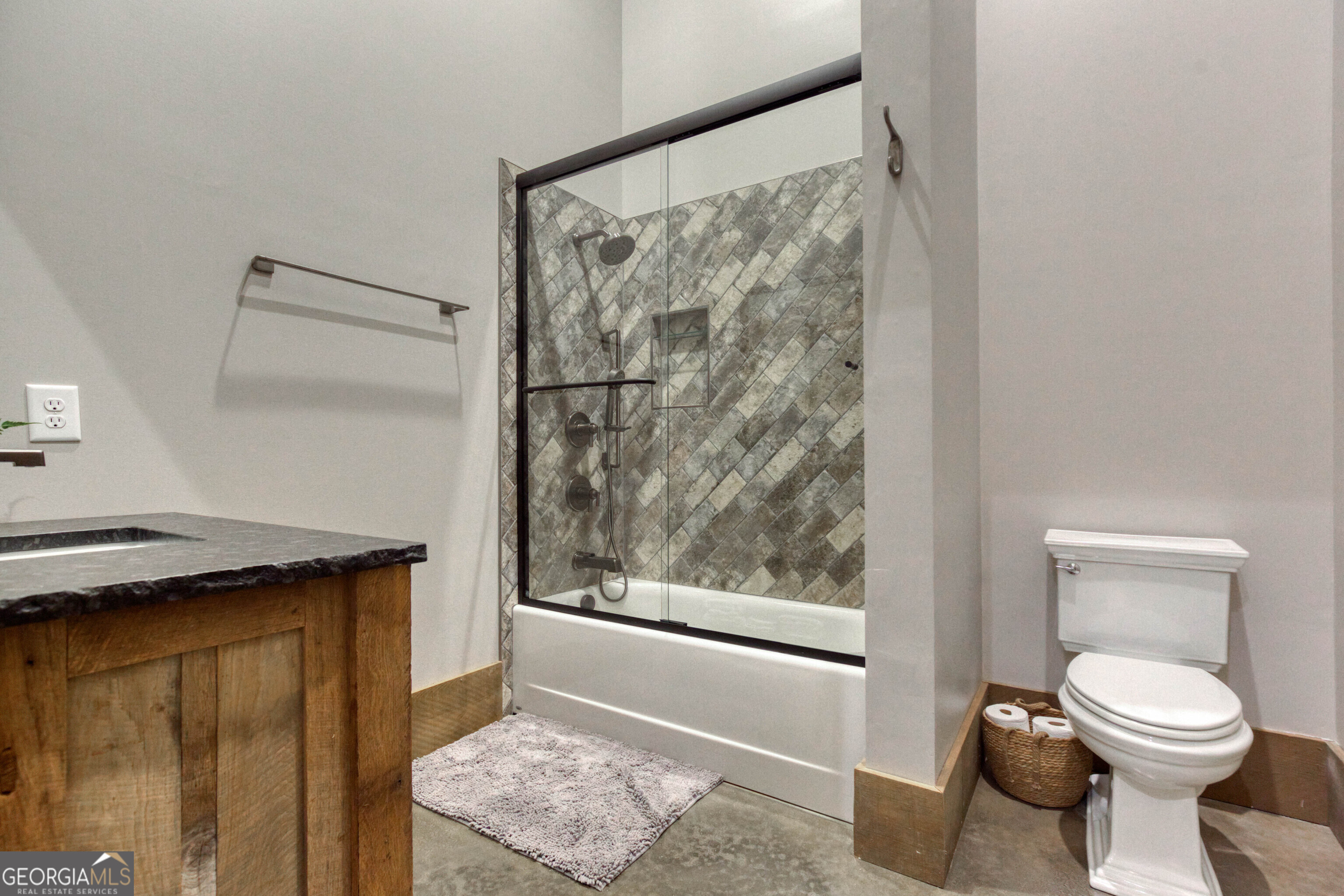 1968 Bobby Brown State Park Road Elberton, GA 30635 - Photo 52 of 97 a bathroom with a granite countertop sink and a toilet