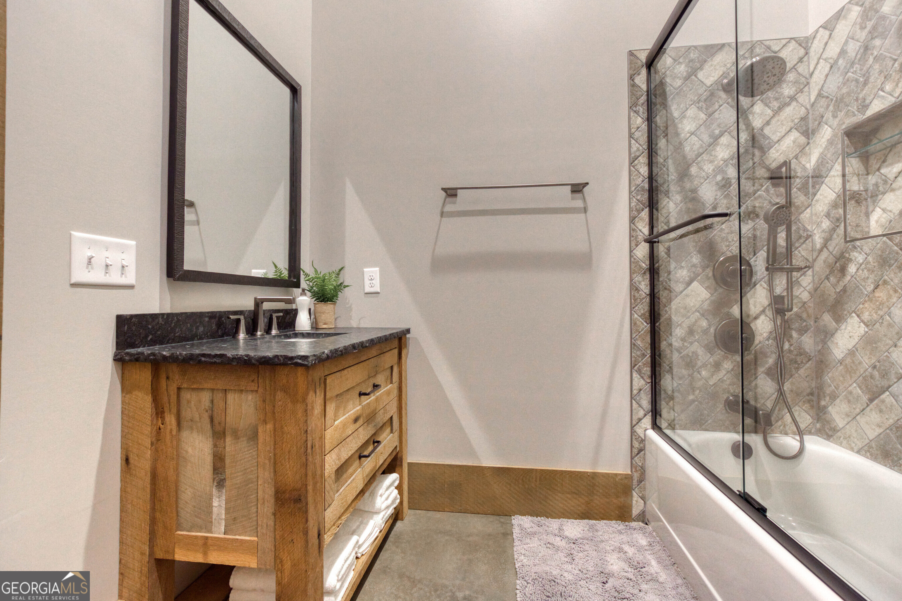 1968 Bobby Brown State Park Road Elberton, GA 30635 - Photo 53 of 97 a bathroom with a granite countertop sink and a mirror