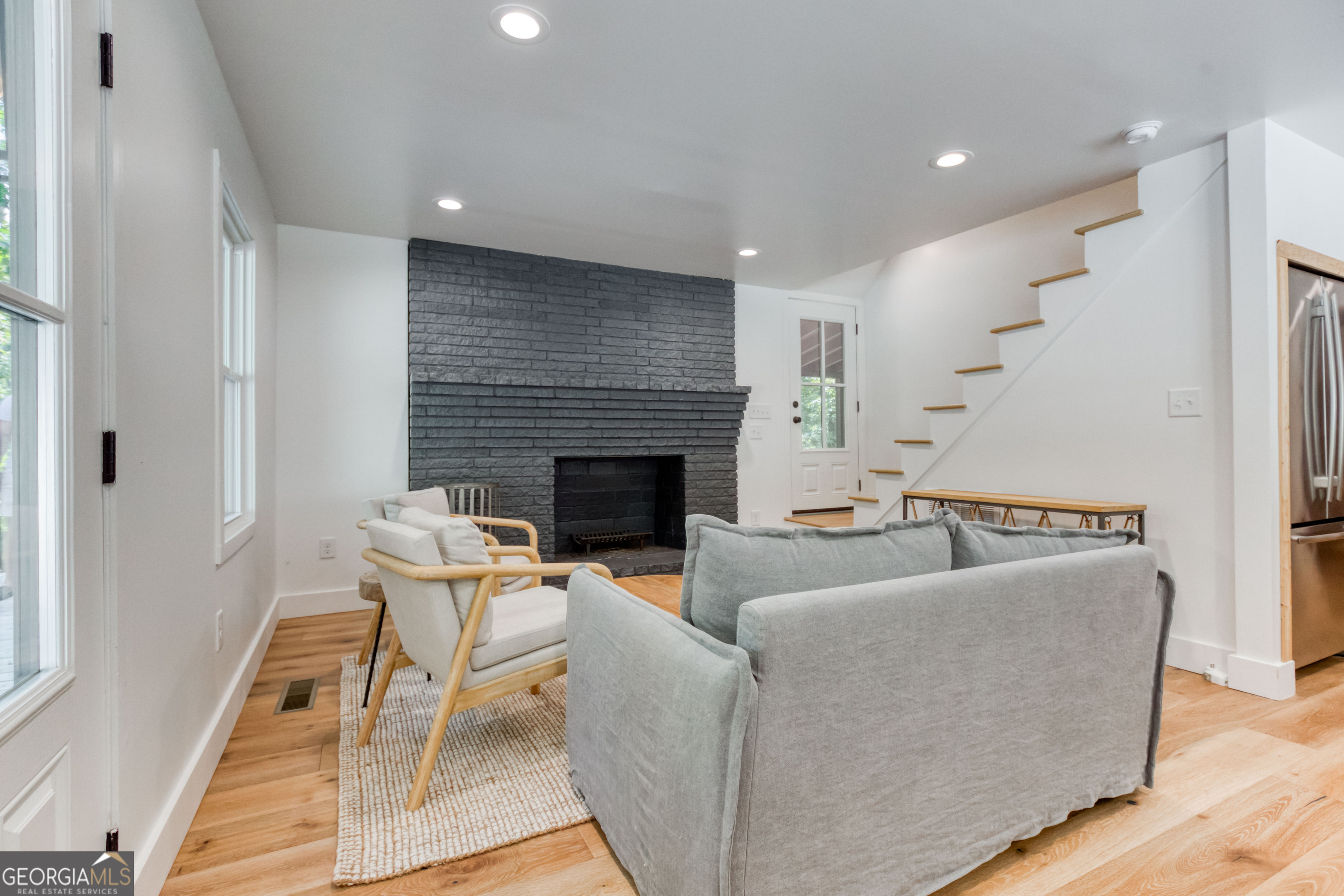 1968 Bobby Brown State Park Road Elberton, GA 30635 - Photo 74 of 97 a living room with couches chairs and a fireplace