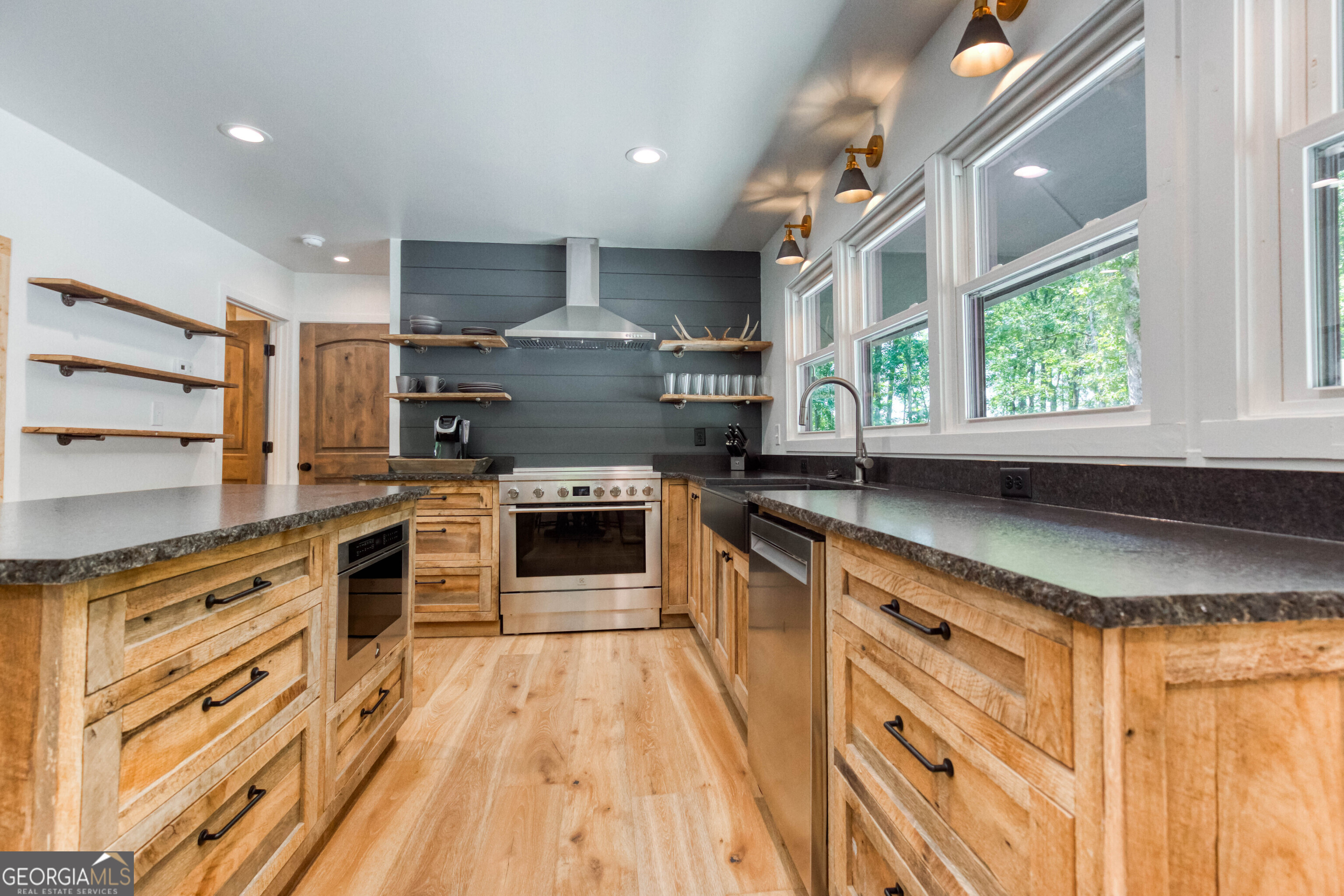 1968 Bobby Brown State Park Road Elberton, GA 30635 - Photo 80 of 97 a kitchen with stainless steel appliances granite countertop a stove a sink and a refrigerator