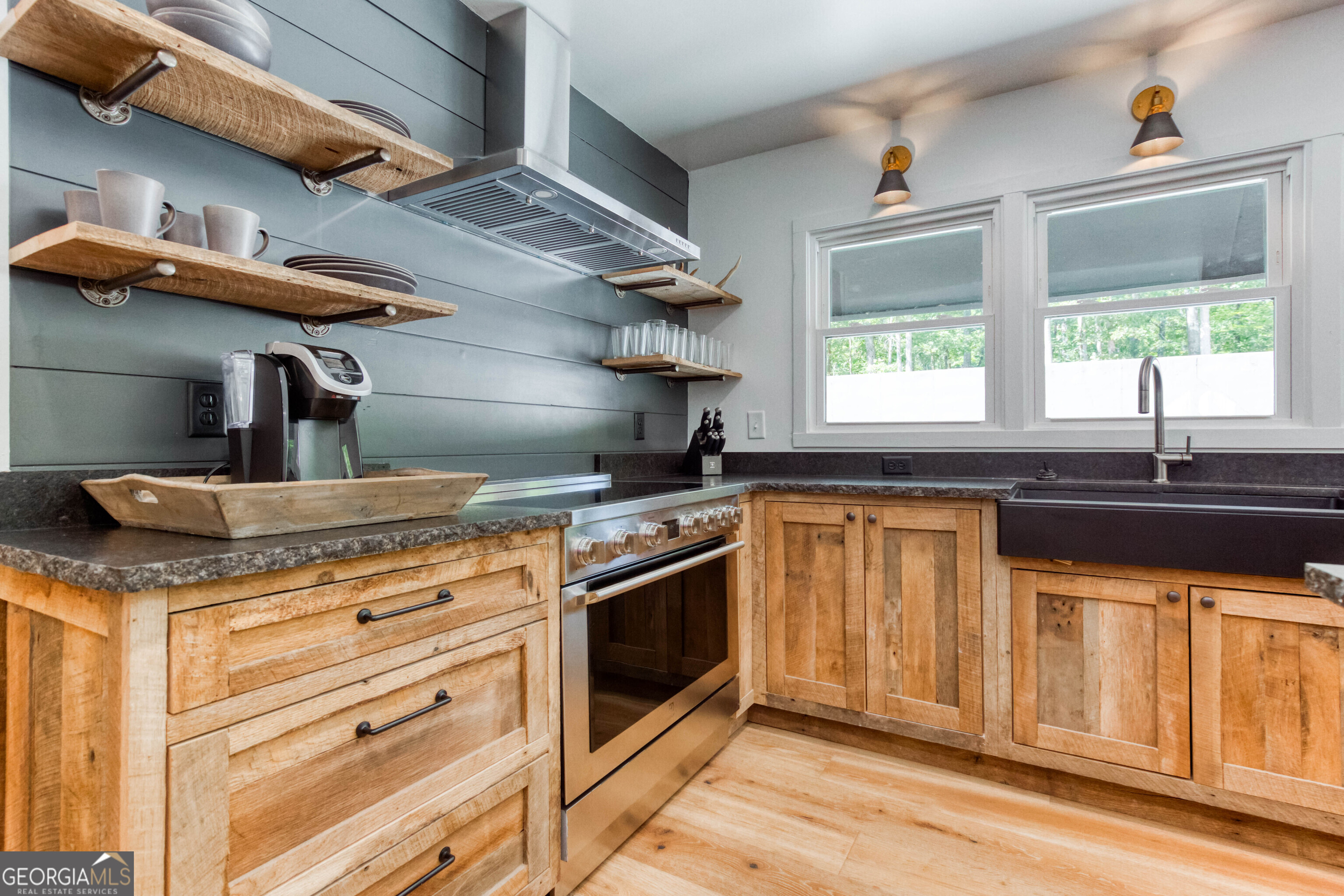 1968 Bobby Brown State Park Road Elberton, GA 30635 - Photo 81 of 97 a kitchen with stainless steel appliances granite countertop a stove a sink and a microwave