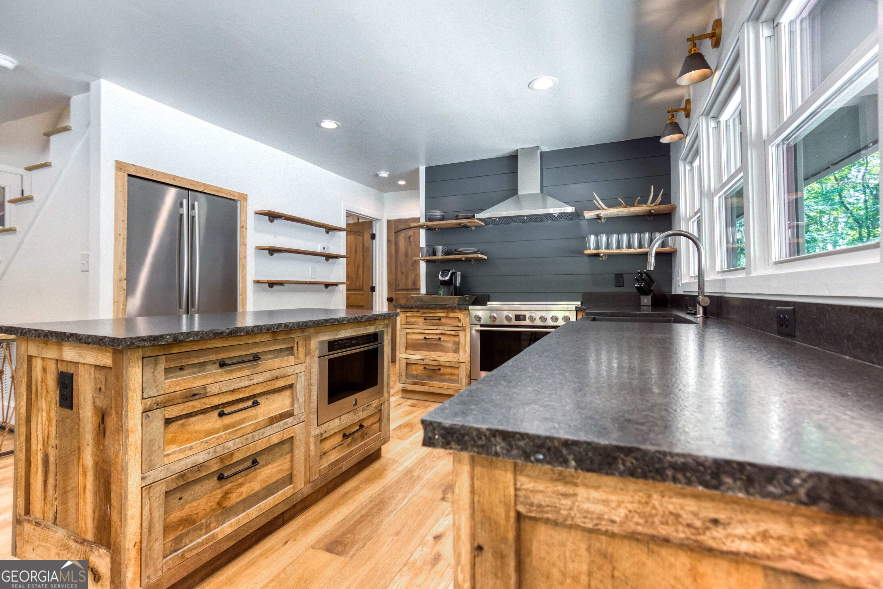 1968 Bobby Brown State Park Road Elberton, GA 30635 - Photo 83 of 97 a kitchen with stainless steel appliances granite countertop a stove a sink and a refrigerator